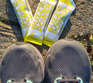 Buzz Power organic honey energy fuel and pair of running shoes